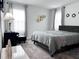 Inviting bedroom featuring a comfortable bed with stylish accents, creating a serene and restful atmosphere at 1902 Presley Pl, Kissimmee, FL 34746