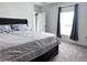 Bedroom with a large bed, neutral colors, and a window for natural light at 1902 Presley Pl, Kissimmee, FL 34746