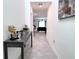 Inviting hallway with modern decor and a view into the living area at 1902 Presley Pl, Kissimmee, FL 34746