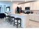 Beautiful kitchen with white cabinets, stainless steel appliances, and a center island at 1902 Presley Pl, Kissimmee, FL 34746