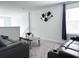 Upstairs living area features plush seating and a decorative wall hanging at 1902 Presley Pl, Kissimmee, FL 34746