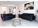Stylish living room featuring comfortable sofas, chic decor, and an open-concept layout at 1902 Presley Pl, Kissimmee, FL 34746