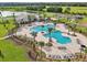 Stunning aerial view of the community pool area, a luxurious oasis for relaxation and recreation at 1902 Presley Pl, Kissimmee, FL 34746
