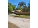 View of house with wooden fence and driveway at 21230 Orange Ct, Mount Dora, FL 32757