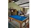 Living room with pool table at 21230 Orange Ct, Mount Dora, FL 32757