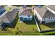 Aerial view of a home with a large backyard, patio, and surrounding fenced yard at 2126 Derwent Dr, Davenport, FL 33896