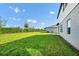Spacious, fenced backyard showcasing well-maintained lawn and a seating area at 2126 Derwent Dr, Davenport, FL 33896