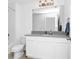 Bright bathroom featuring a single vanity and shower with tub combination at 2126 Derwent Dr, Davenport, FL 33896