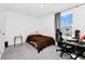 A cozy bedroom with a desk, bed, and ample natural light creates a relaxing atmosphere at 2126 Derwent Dr, Davenport, FL 33896