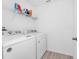 Clean laundry room with a white washer and dryer set at 2126 Derwent Dr, Davenport, FL 33896