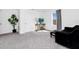 Cozy upstairs living space features comfortable seating and a large plant at 2126 Derwent Dr, Davenport, FL 33896