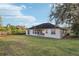 Large backyard with lush green grass and patio at 250 Lakeridge Ct, Winter Springs, FL 32708