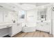 Luxurious bathroom featuring dual vanities, a soaking tub, and modern fixtures, creating a spa-like atmosphere at 250 Lakeridge Ct, Winter Springs, FL 32708