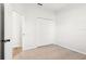 Well-lit bedroom with carpet, a closet, and neutral paint at 250 Lakeridge Ct, Winter Springs, FL 32708
