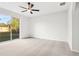 Bright, airy bedroom featuring carpeted floors, ceiling fan, and natural light at 250 Lakeridge Ct, Winter Springs, FL 32708