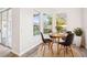 Cozy dining area with wood-look flooring, natural light, and views of the backyard at 250 Lakeridge Ct, Winter Springs, FL 32708
