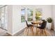 Cozy dining area with wood-look flooring, natural light, and views of the backyard at 250 Lakeridge Ct, Winter Springs, FL 32708