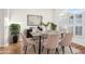 Bright dining room featuring neutral furniture, stylish decor, and a large window for ample natural light at 250 Lakeridge Ct, Winter Springs, FL 32708