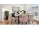 Bright dining room featuring neutral furniture, stylish decor, and a large window for ample natural light at 250 Lakeridge Ct, Winter Springs, FL 32708