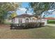 Beautiful single-story home showcasing manicured landscaping and architectural columns at 250 Lakeridge Ct, Winter Springs, FL 32708
