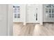 Bright foyer with light wood flooring, white walls and an inviting entrance at 250 Lakeridge Ct, Winter Springs, FL 32708