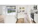Bright kitchen featuring stainless appliances, island with a sink, and an eat-in area overlooking the yard at 250 Lakeridge Ct, Winter Springs, FL 32708