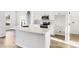 Well-lit kitchen featuring an island and stainless appliances. Cabinets offer lots of storage at 250 Lakeridge Ct, Winter Springs, FL 32708