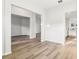 Spacious living room with wood-look flooring, neutral walls, and open doorways at 250 Lakeridge Ct, Winter Springs, FL 32708
