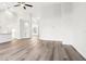 Bright, spacious living room featuring new light wood flooring and ample natural light at 250 Lakeridge Ct, Winter Springs, FL 32708