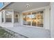Spacious outdoor patio with room to entertain, featuring a large sliding glass door at 250 Lakeridge Ct, Winter Springs, FL 32708