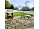 Outdoor patio and backyard featuring a playhouse and backyard furniture at 25012 Chipshot Ct, Sorrento, FL 32776