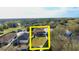 An aerial view of the house with a large backyard and white picket fence at 25012 Chipshot Ct, Sorrento, FL 32776