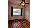 Bedroom featuring modern flooring, a ceiling fan, and closet doors at 25012 Chipshot Ct, Sorrento, FL 32776