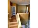 Upstairs hallway with wood-look floors leading to the bedrooms, all freshly painted at 25012 Chipshot Ct, Sorrento, FL 32776