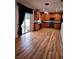 Bright kitchen with wood cabinets, stainless steel appliances, and sliding glass doors to the backyard at 25012 Chipshot Ct, Sorrento, FL 32776
