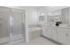 Elegant bathroom featuring a glass-enclosed shower, soaking tub, and dual sinks at 2750 Slash Way, St Cloud, FL 34771
