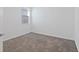 Clean, carpeted bedroom offers a comfortable space with natural light from the window at 2750 Slash Way, St Cloud, FL 34771