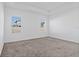 Well-lit carpeted bedroom features two windows and a tray ceiling at 2750 Slash Way, St Cloud, FL 34771