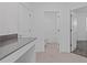 Hallway featuring a view of a full bathroom and bedroom at 2750 Slash Way, St Cloud, FL 34771