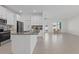 Open-concept kitchen flowing into a bright living space with modern tile flooring at 2750 Slash Way, St Cloud, FL 34771