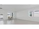Bright and airy living room with tile floors, large windows, and modern décor at 2750 Slash Way, St Cloud, FL 34771