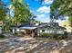 Back of home with a covered patio area, great for enjoying the outdoors at 31024 Prestwick Ave, Sorrento, FL 32776