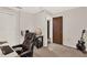Bedroom with neutral walls, carpet floors, and a standard closet for additional storage at 31024 Prestwick Ave, Sorrento, FL 32776