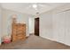 Bedroom featuring neutral walls, carpet floors, and a double-door closet providing ample storage space at 31024 Prestwick Ave, Sorrento, FL 32776
