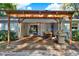 Backyard covered deck perfect for grilling with outdoor kitchen and dining set at 31024 Prestwick Ave, Sorrento, FL 32776