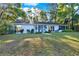 Well-maintained home with large windows, manicured landscaping, and a welcoming entrance at 31024 Prestwick Ave, Sorrento, FL 32776