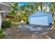 Spacious detached garage with ample parking and storage space, next to a backyard deck at 31024 Prestwick Ave, Sorrento, FL 32776