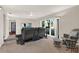Comfortable living room with a large window, plush seating, and cozy decor at 31024 Prestwick Ave, Sorrento, FL 32776