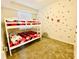 Playful bedroom featuring a bunk bed with bright red and black Mickey Mouse linens at 3121 Paradox Cir # 307, Kissimmee, FL 34746