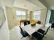 Open floorplan game room features a foosball table, dining table, and natural light at 3121 Paradox Cir # 307, Kissimmee, FL 34746